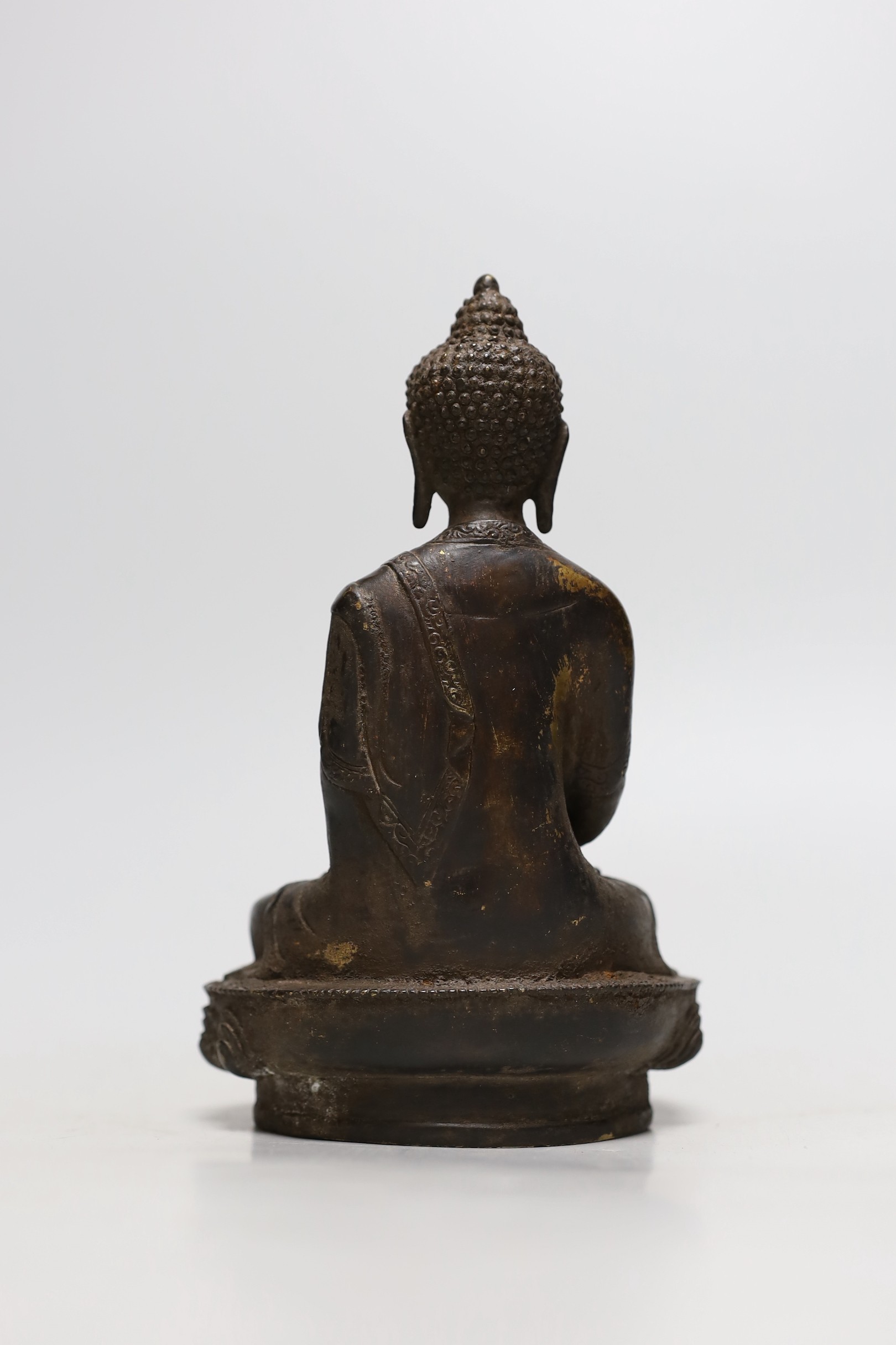 A Himalayan bronze figure of Buddha, 19.5cms high